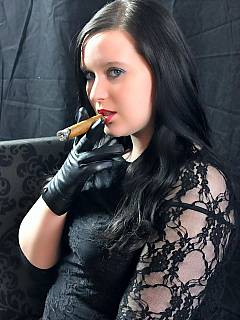 Young dominatrix is smoking and blowing smoke into your face